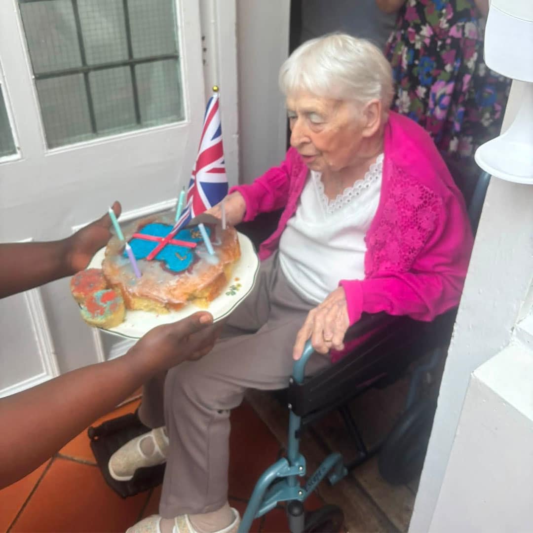 Janet celebrating with her birthday cake